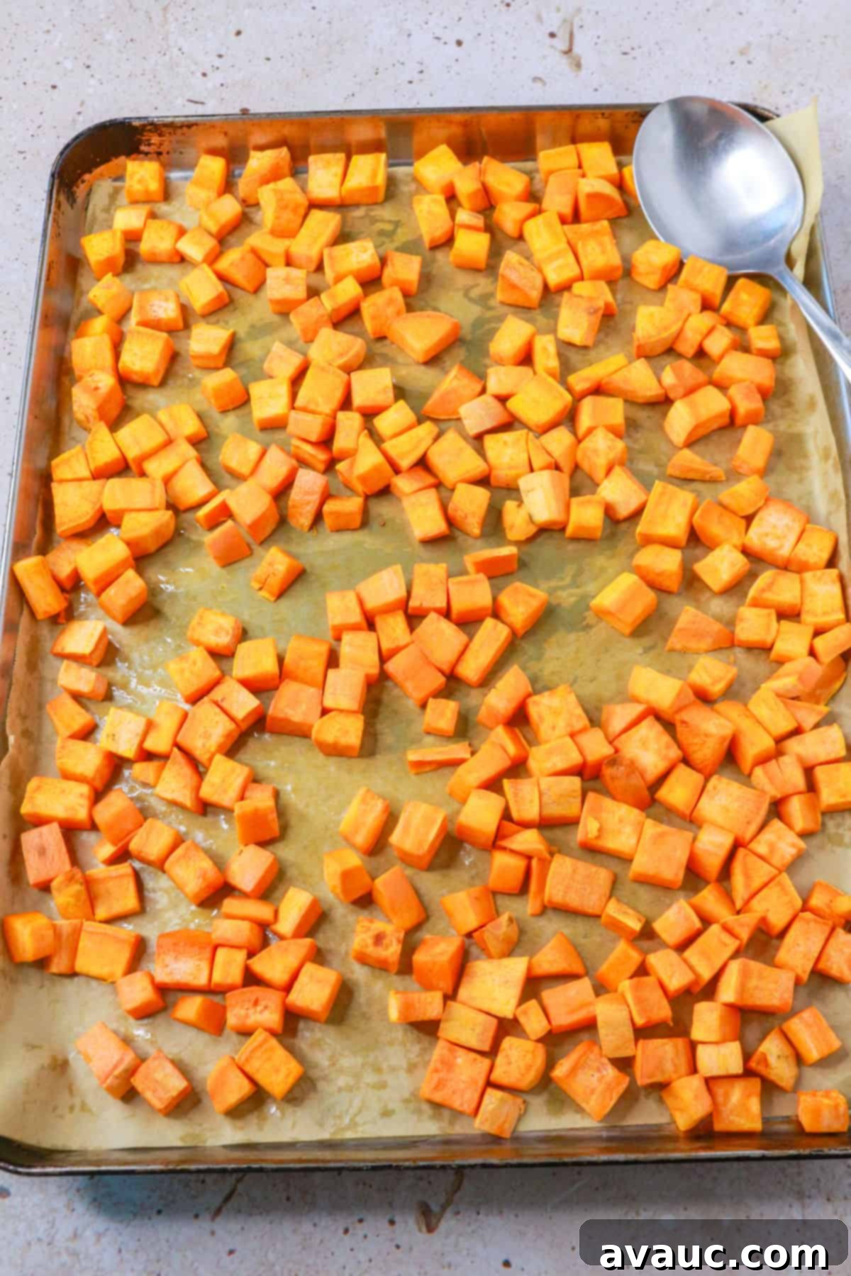 Sweet Potato Avocado Salad 5 roasted diced sweet potatoes on a baking sheet, golden and tender