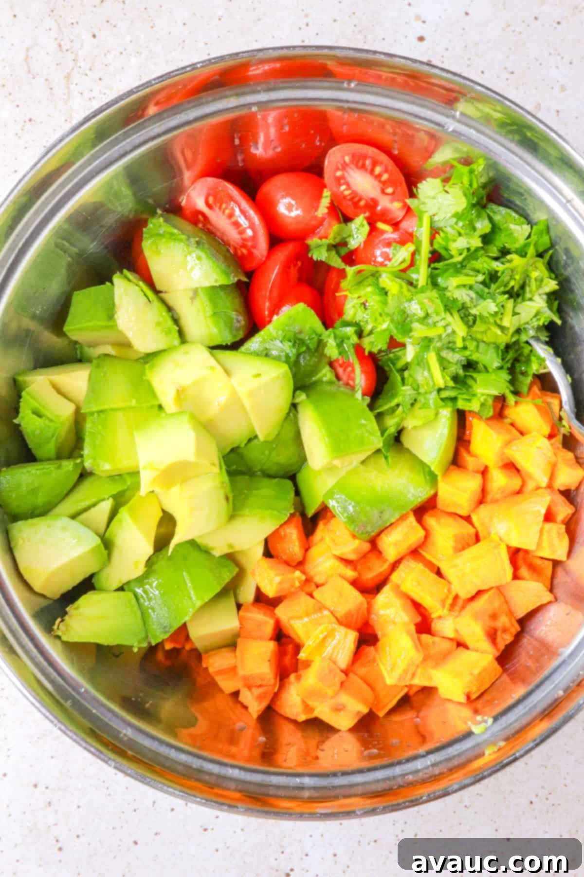 Sweet Potato Avocado Salad 7 Chopped ingredients for sweet potato salad in a mixing bowl ready for dressing