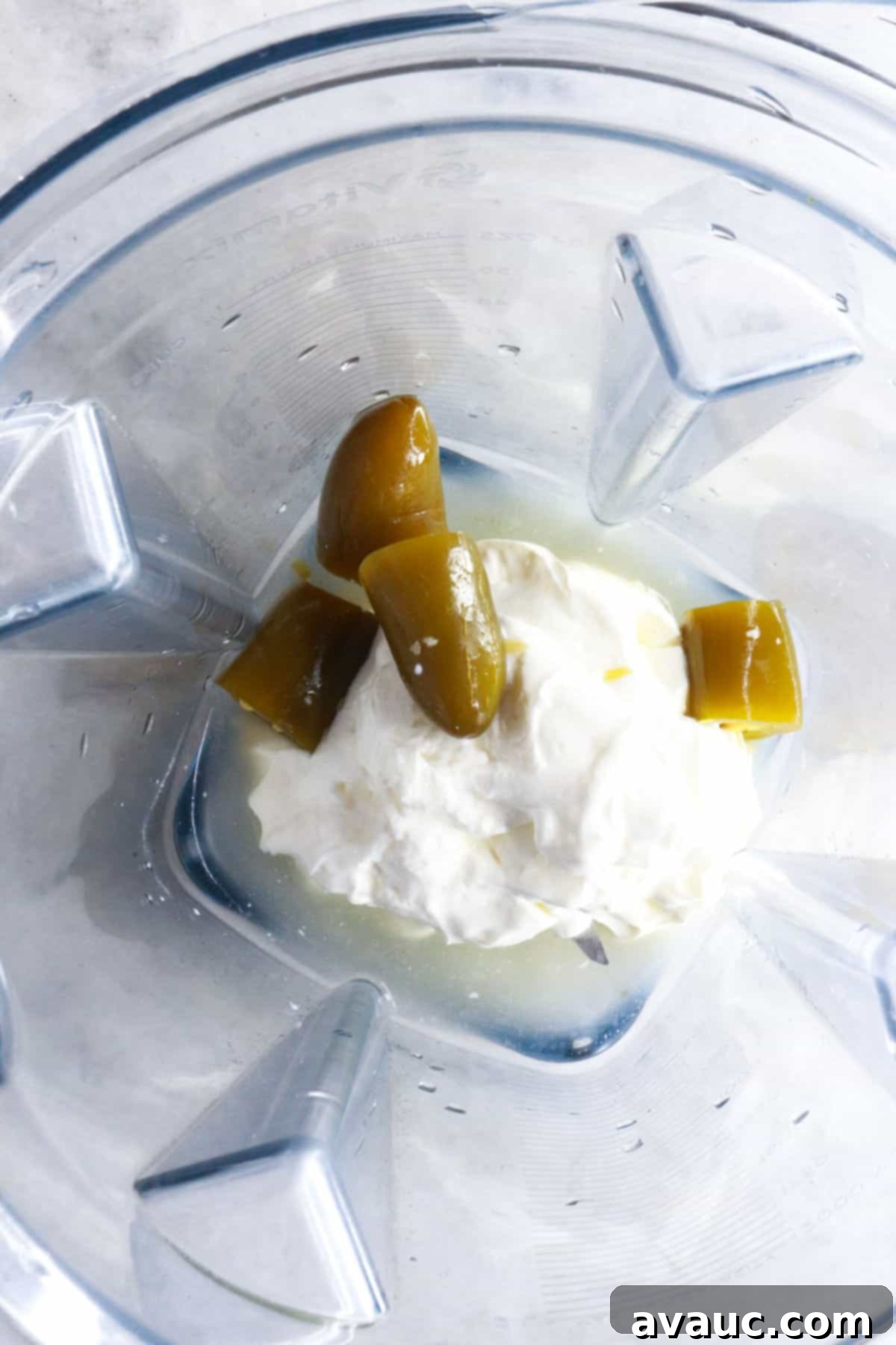 Sour cream and jalapeños in a blender