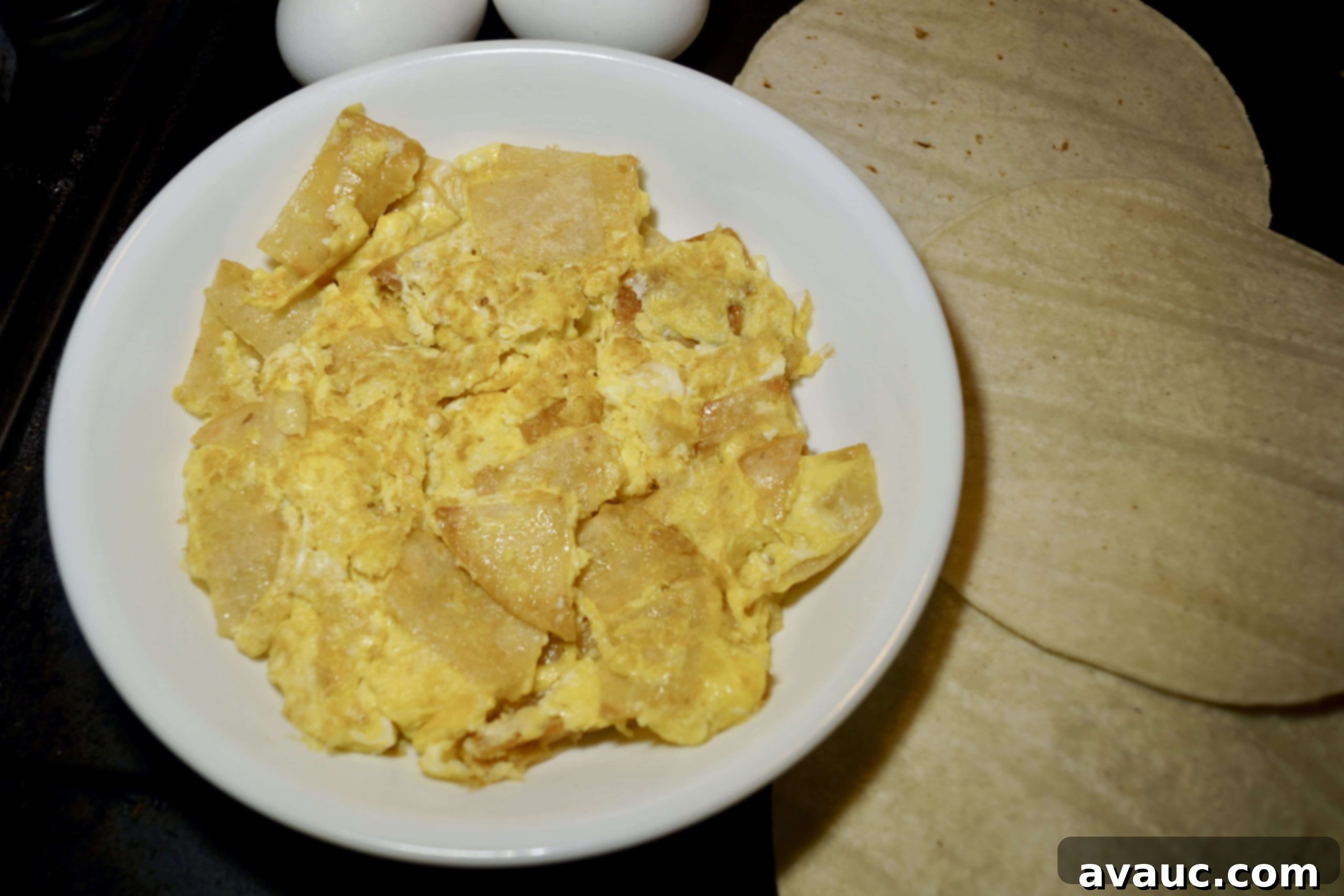 Easy and fast breakfast huevos con tortilla, a classic Mexican breakfast dish, perfect for a quick and simple meal. #mexicanbreakfast #easybreakfast #huevoscontortilla