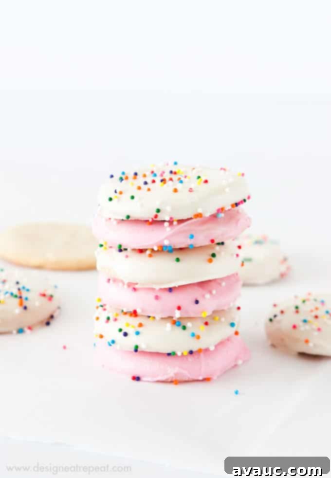 Crispy Frosted Animal Cookie Wafers 4 Ingredients and tools laid out for making Homemade Frosted Animal Cookie Wafers, including dough, almond bark, and sprinkles.