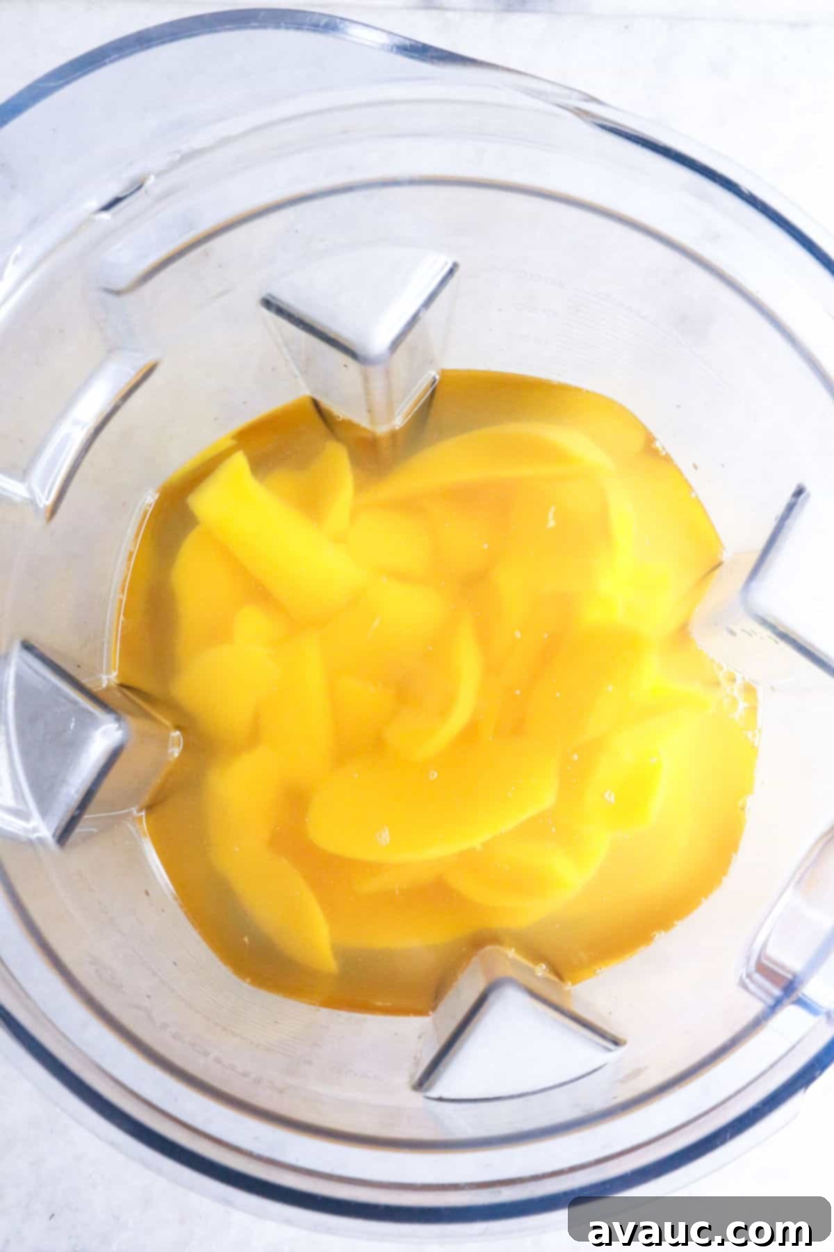 Simple Refreshing Mango Agua Fresca 5 Pieces of mango and water in a blender