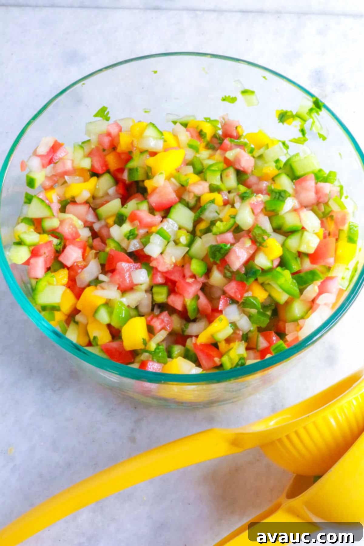 Tropical pico de gallo in a glass bowl