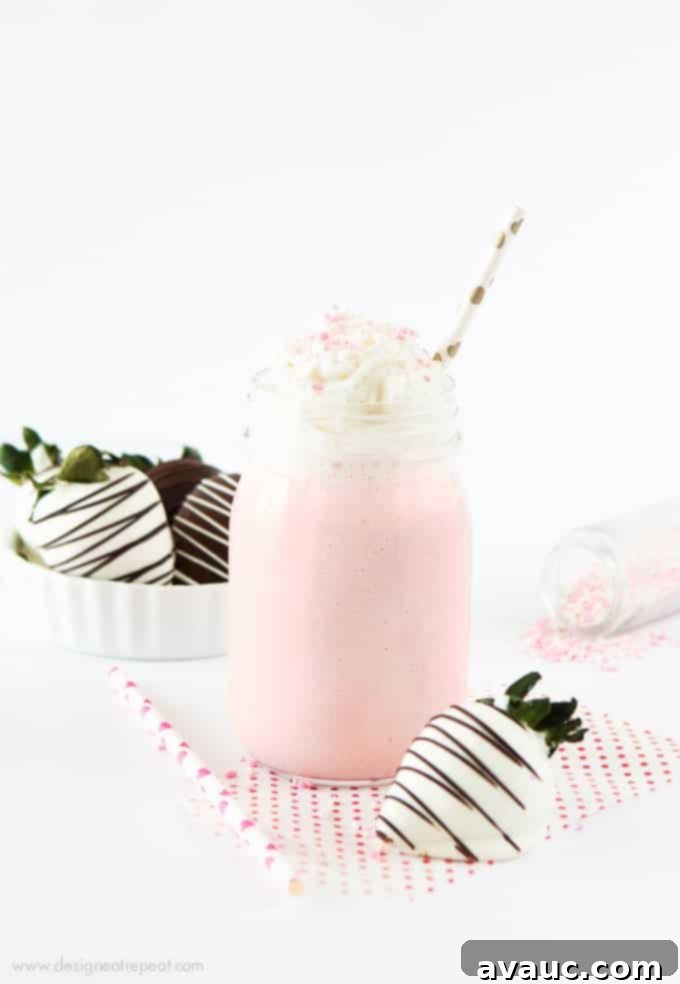 Strawberry Cream Vanilla Bean Frappuccino - a vibrant pink drink topped with whipped cream, perfect for a treat!