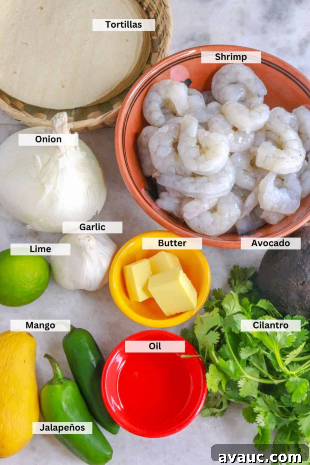 Zesty Shrimp Tacos with Tropical Mango Salsa 3 Ingredients for shrimp tacos with mango salsa: corn tortillas, onion, garlic, lime, mango, jalapeños, butter, oil, cilantro, avocado, shrimp