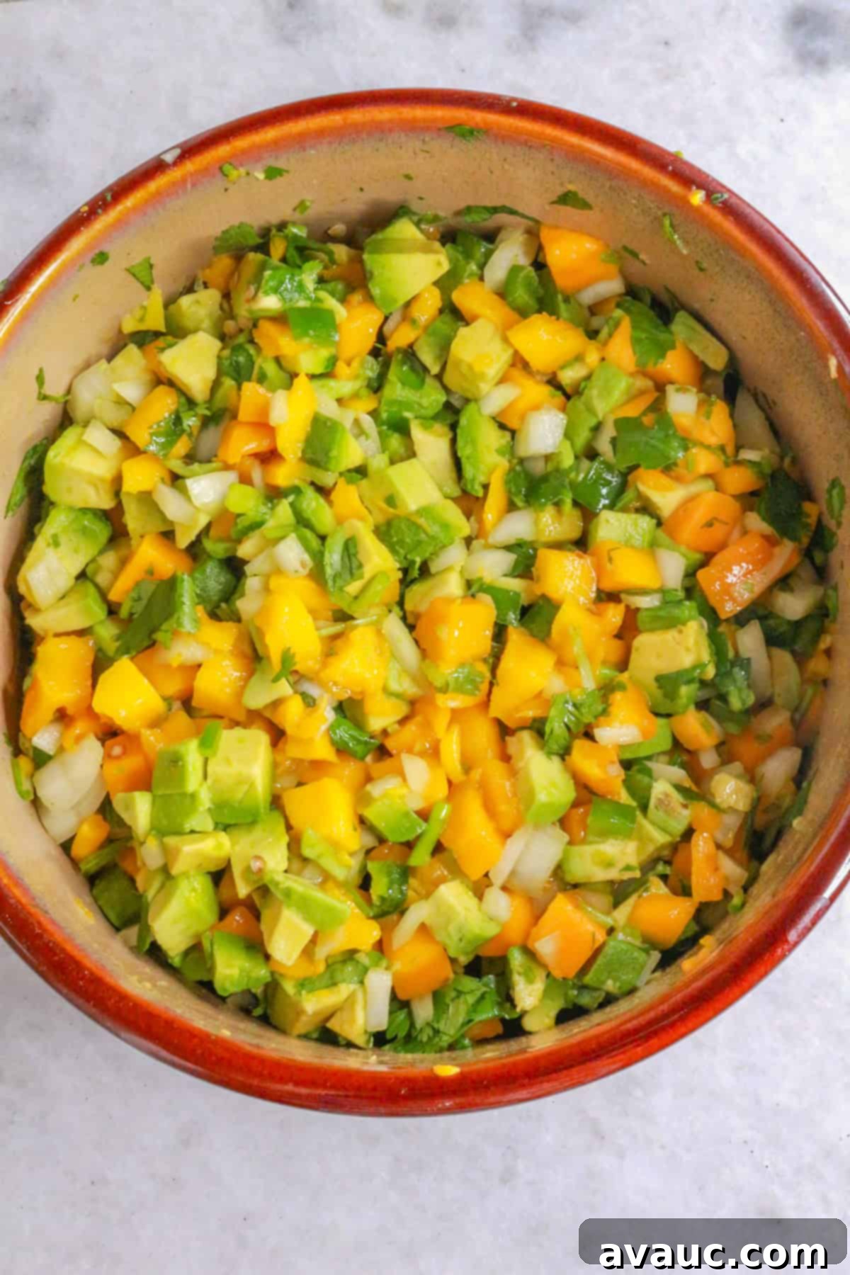 Zesty Shrimp Tacos with Tropical Mango Salsa 5 Mango avocado salsa in a bowl