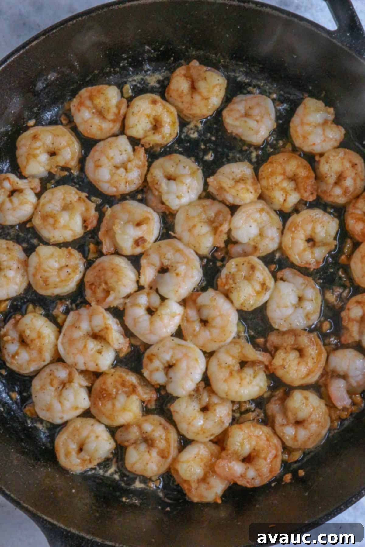 Zesty Shrimp Tacos with Tropical Mango Salsa 7 Sautéing shrimp in a cast-iron skillet