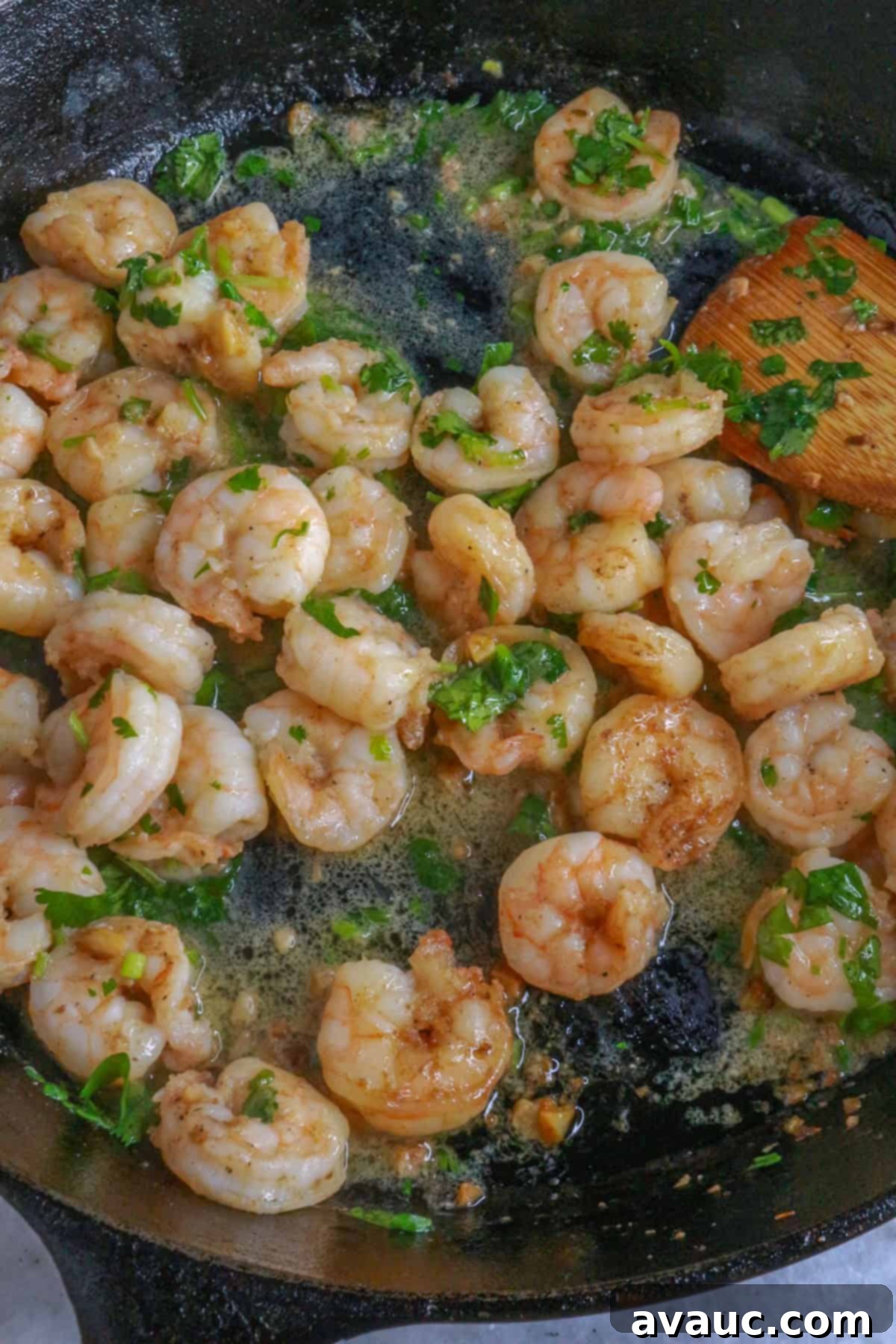 Zesty Shrimp Tacos with Tropical Mango Salsa 8 Sautéing shrimp in a cast iron with cilantro