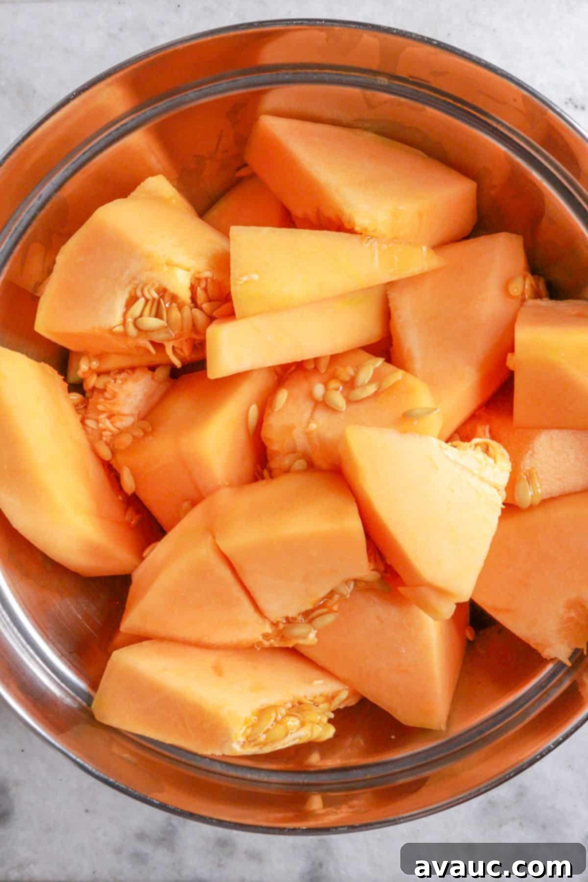 Mexican Melon Refresher 4 Chunks of cantaloupe in a mixing bowl