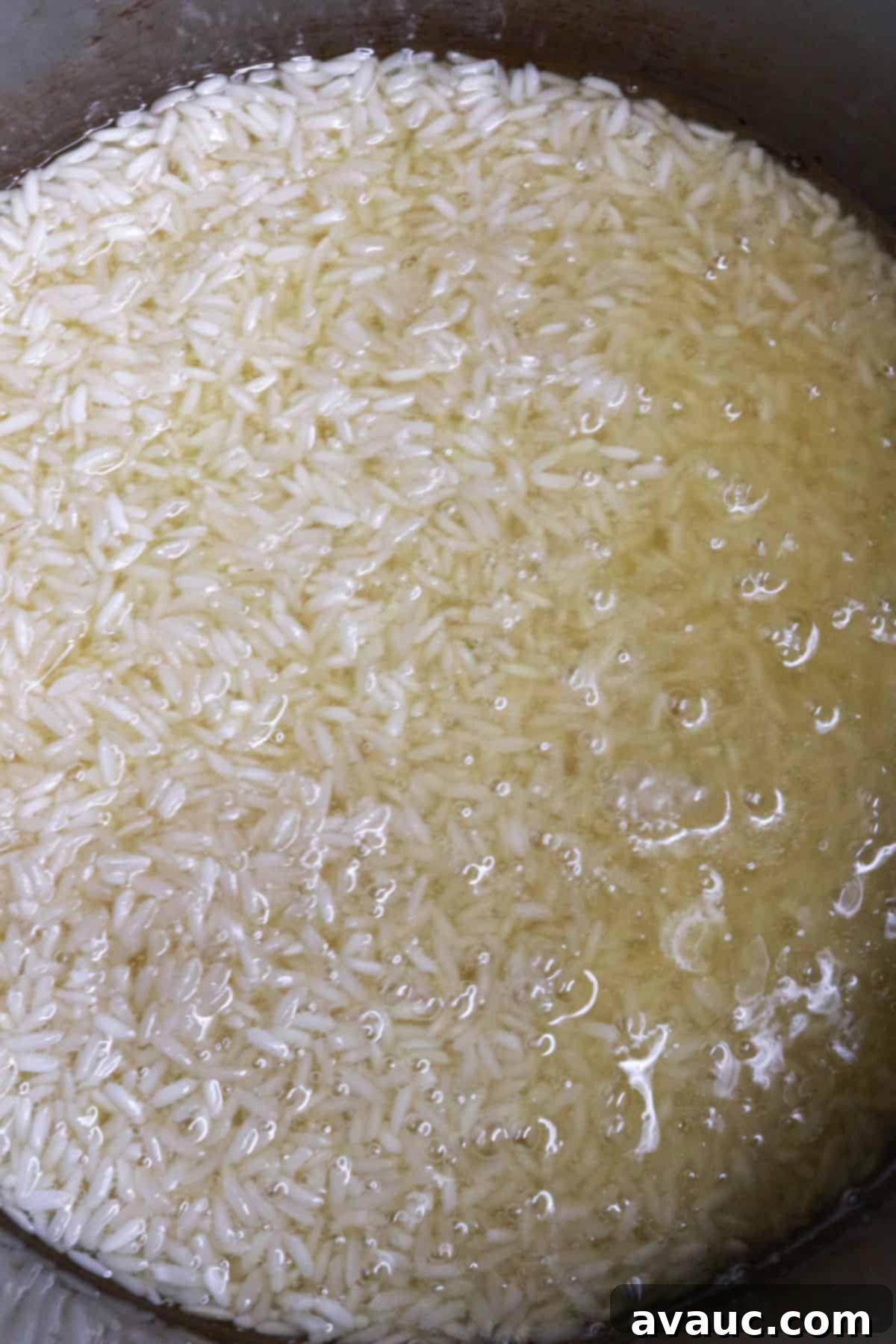 Zesty Mexican White Rice with Sweet Corn 4 White long grain rice being sautéed in hot oil in a saucepan