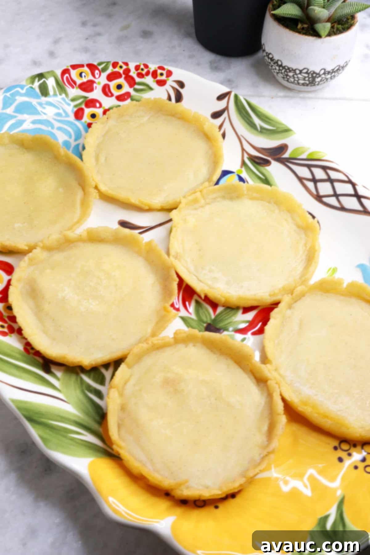 Six perfectly cooked, golden-brown sopes arranged beautifully on a platter, ready for toppings