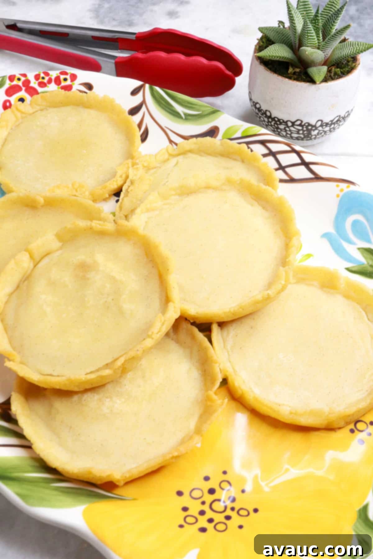 A beautiful stack of freshly fried and unfilled sopes on a platter, ready for topping