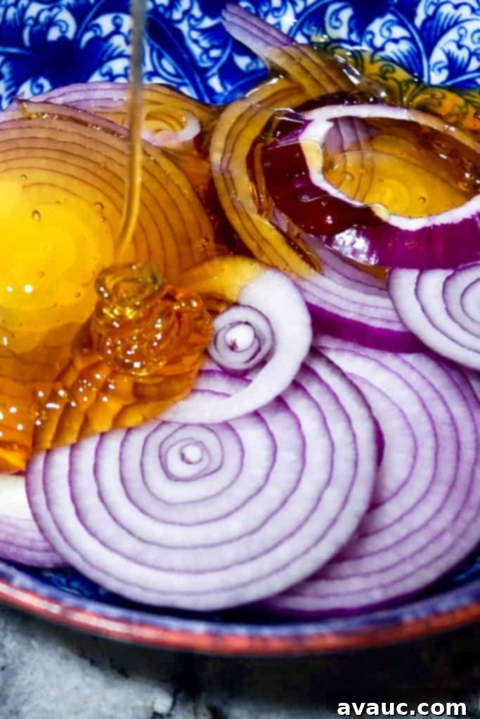 Craft Your Own Cough Syrup 5 Pouring honey over onions for homemade cough syrup