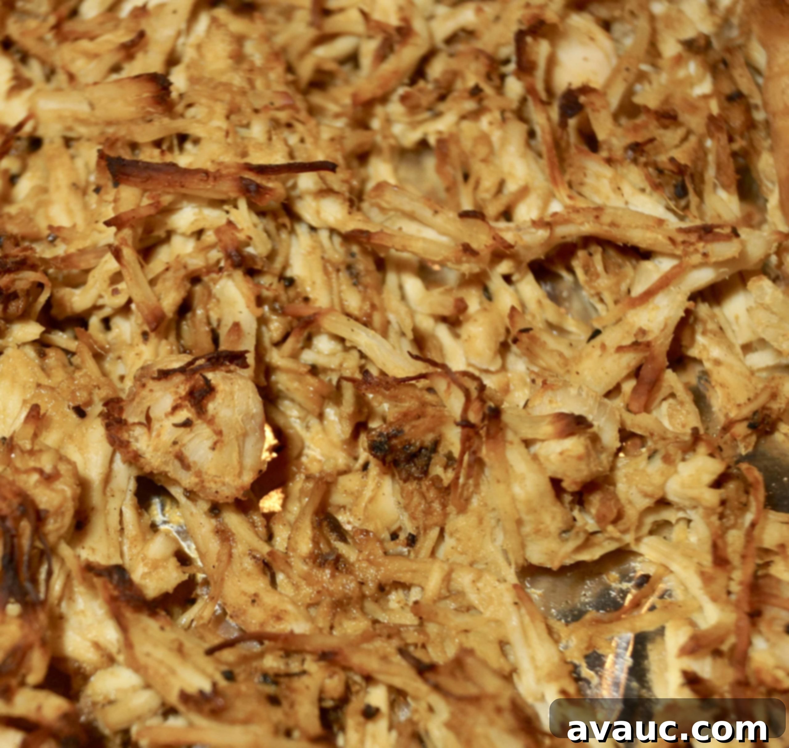 Golden brown crispy shredded chicken after broiling, perfect for tacos. #crispychicken #tacomaking