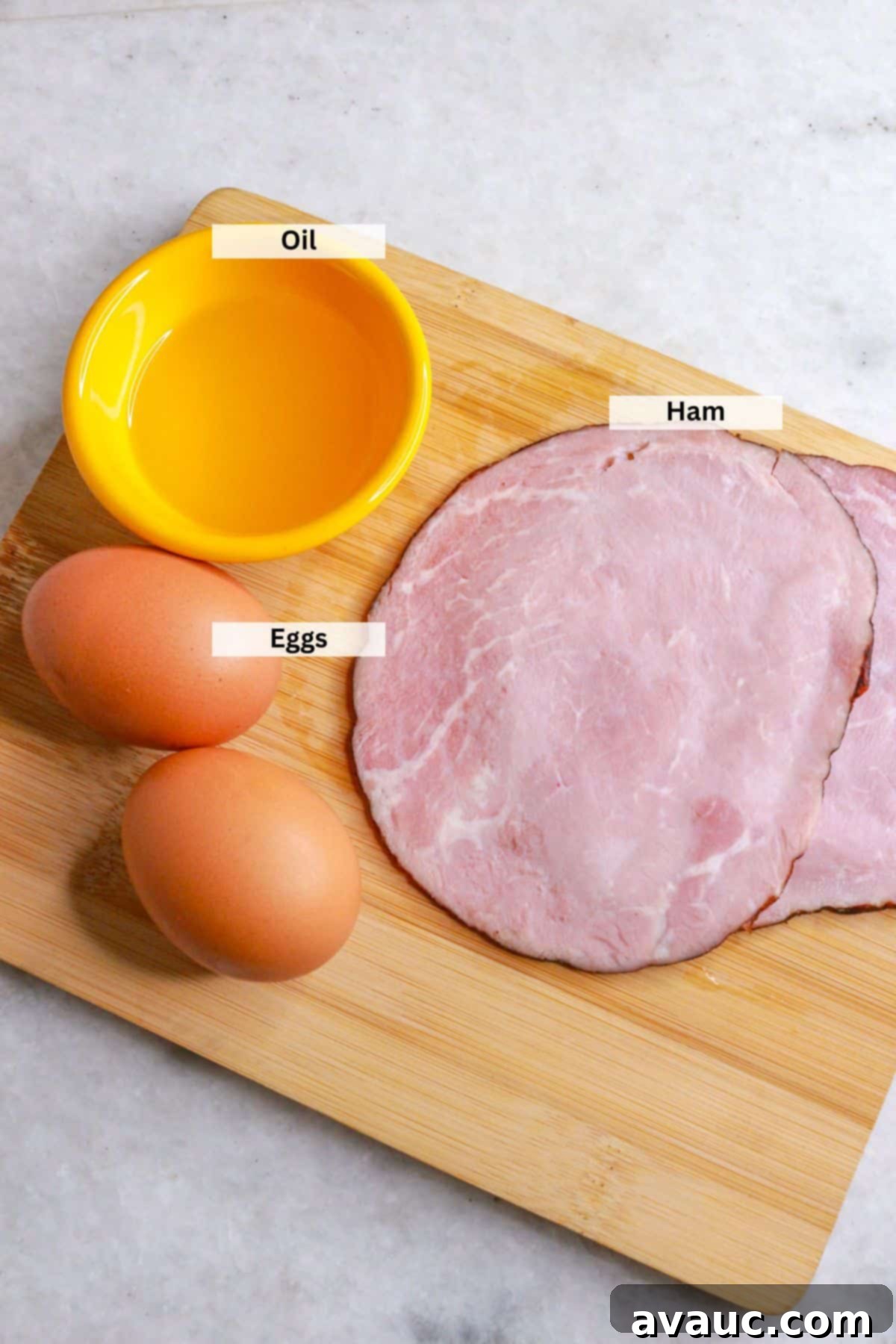 Classic Ham and Egg Scramble 3 Ingredients for huevos con jamon: Two slices of ham, two eggs and small bowl with oil