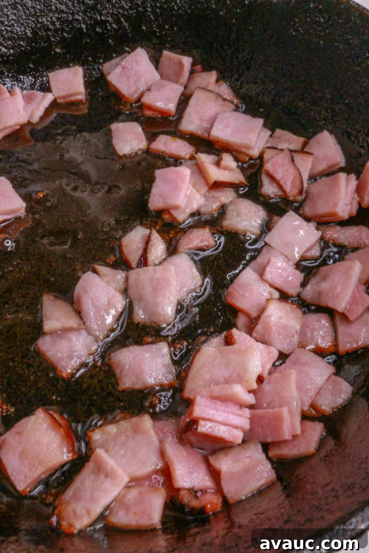 Classic Ham and Egg Scramble 5 diced ham frying in a pan
