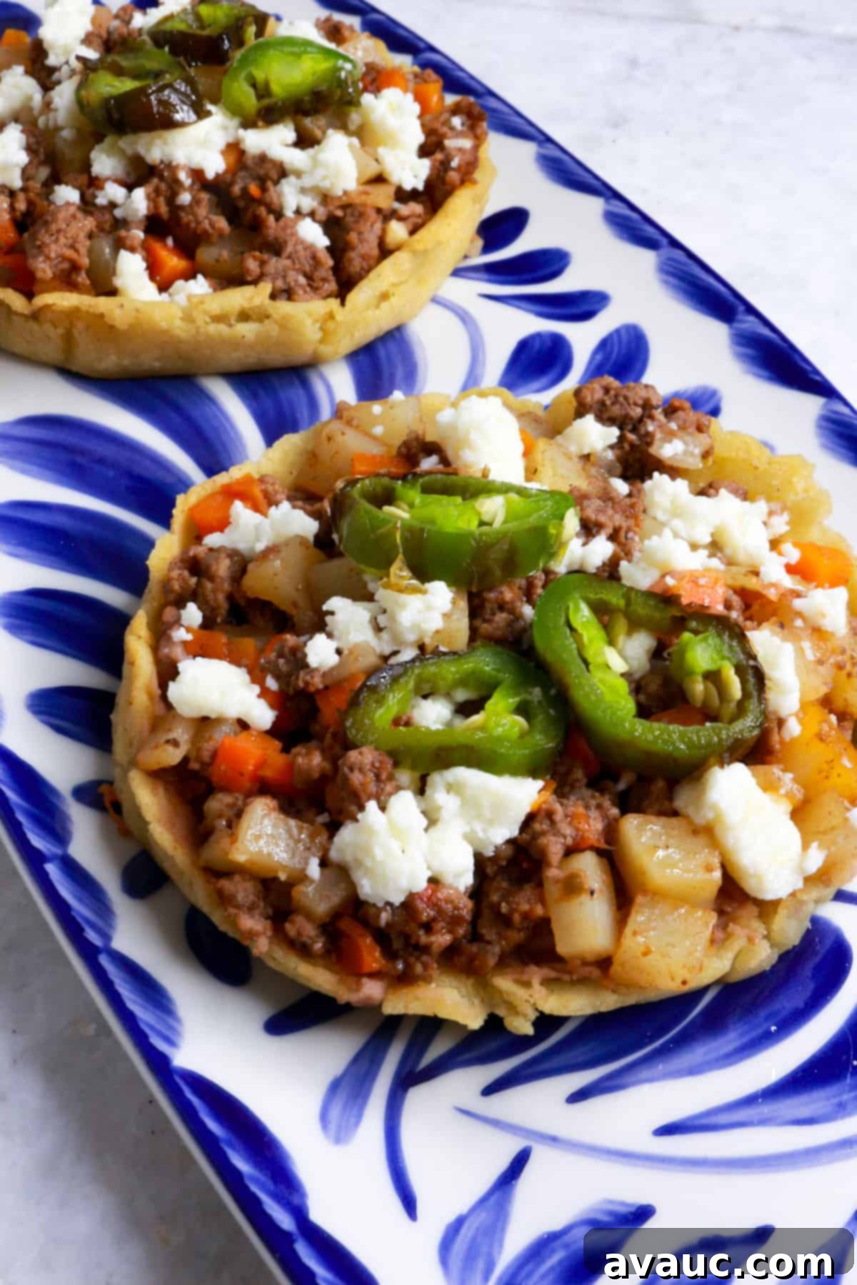Sopes de Picadillo on a blue Mexican platter
