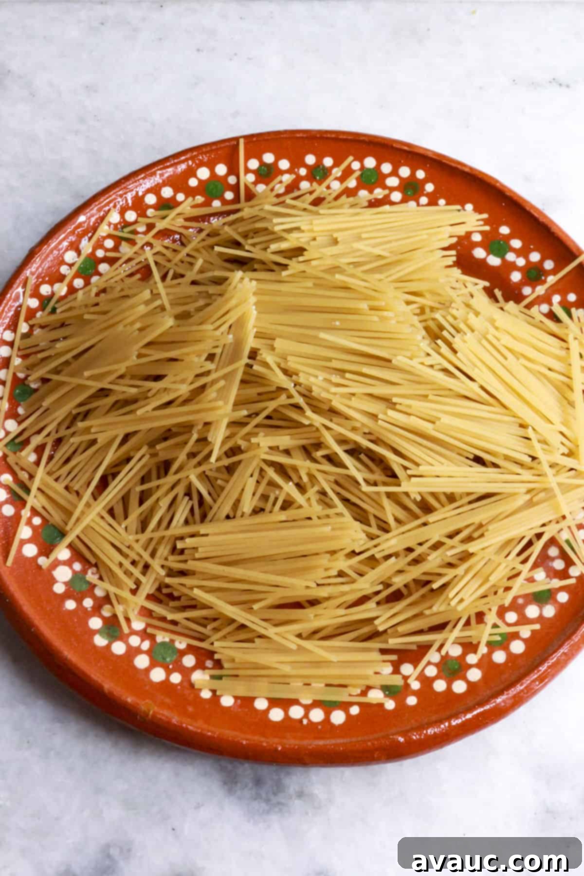 Delicious Gluten-Free Mexican Fideo Soup 5 Broken gluten-free noodles in a brown plate ready to be used for sopita de fideo