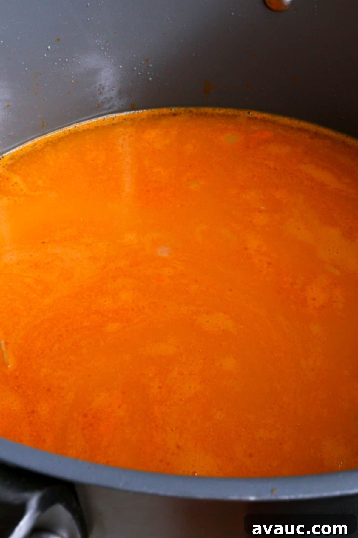Delicious Gluten-Free Mexican Fideo Soup 8 Sopa de fideo broth simmering in a large pot