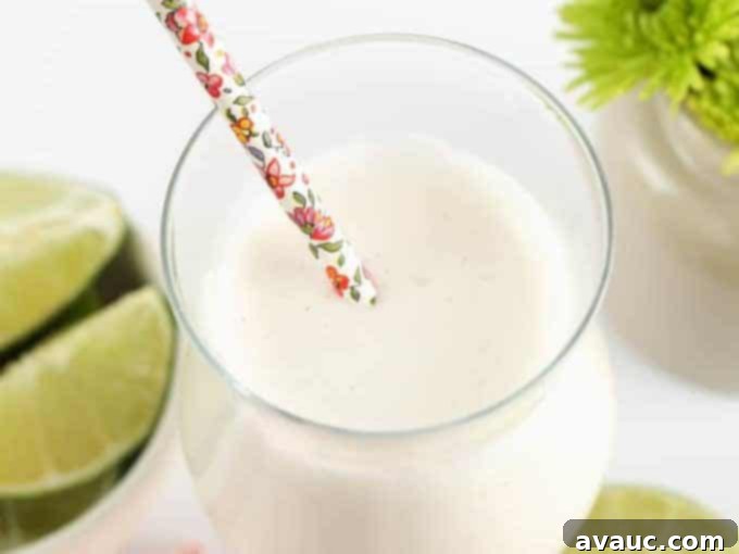 Delicious Frozen Vanilla Coconut Lime Refresher with floral straws