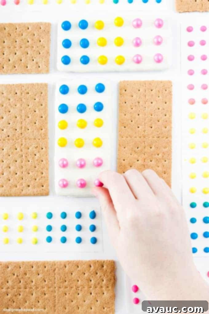 Fun Candy Button Graham Cracker Bars 3 How to make DIY Candy Button Graham Cracker Bars with melted almond bark.