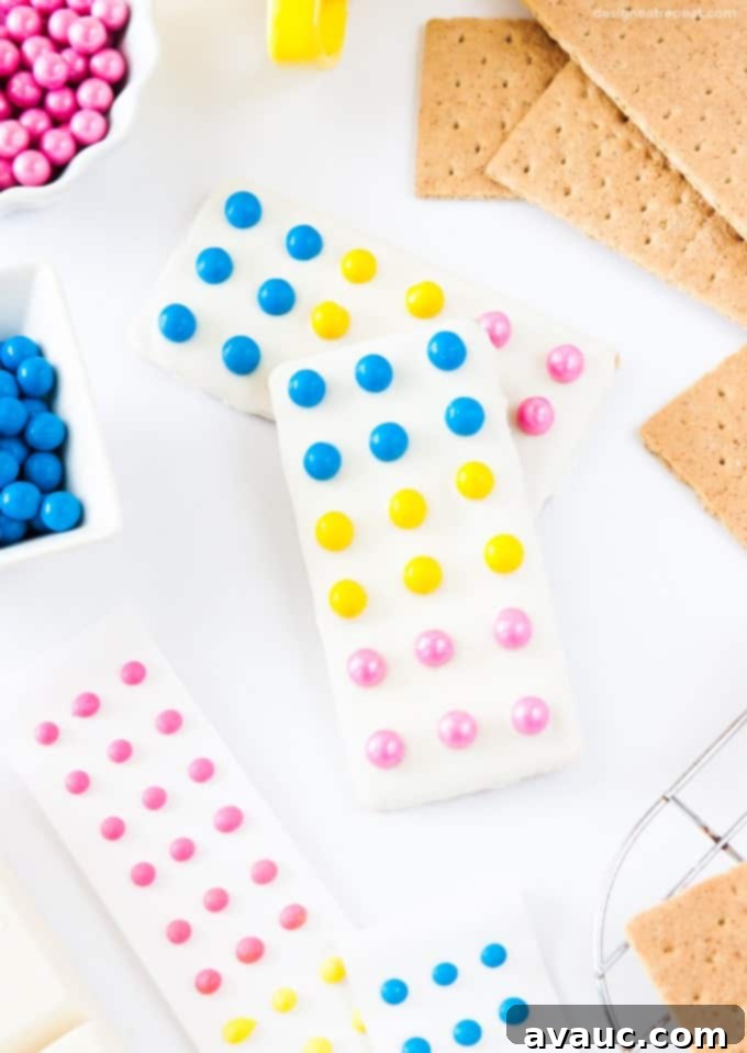 Fun Candy Button Graham Cracker Bars 4 Turn graham crackers into candy button bars with almond bark & Sixlets for a fun, easy dessert.