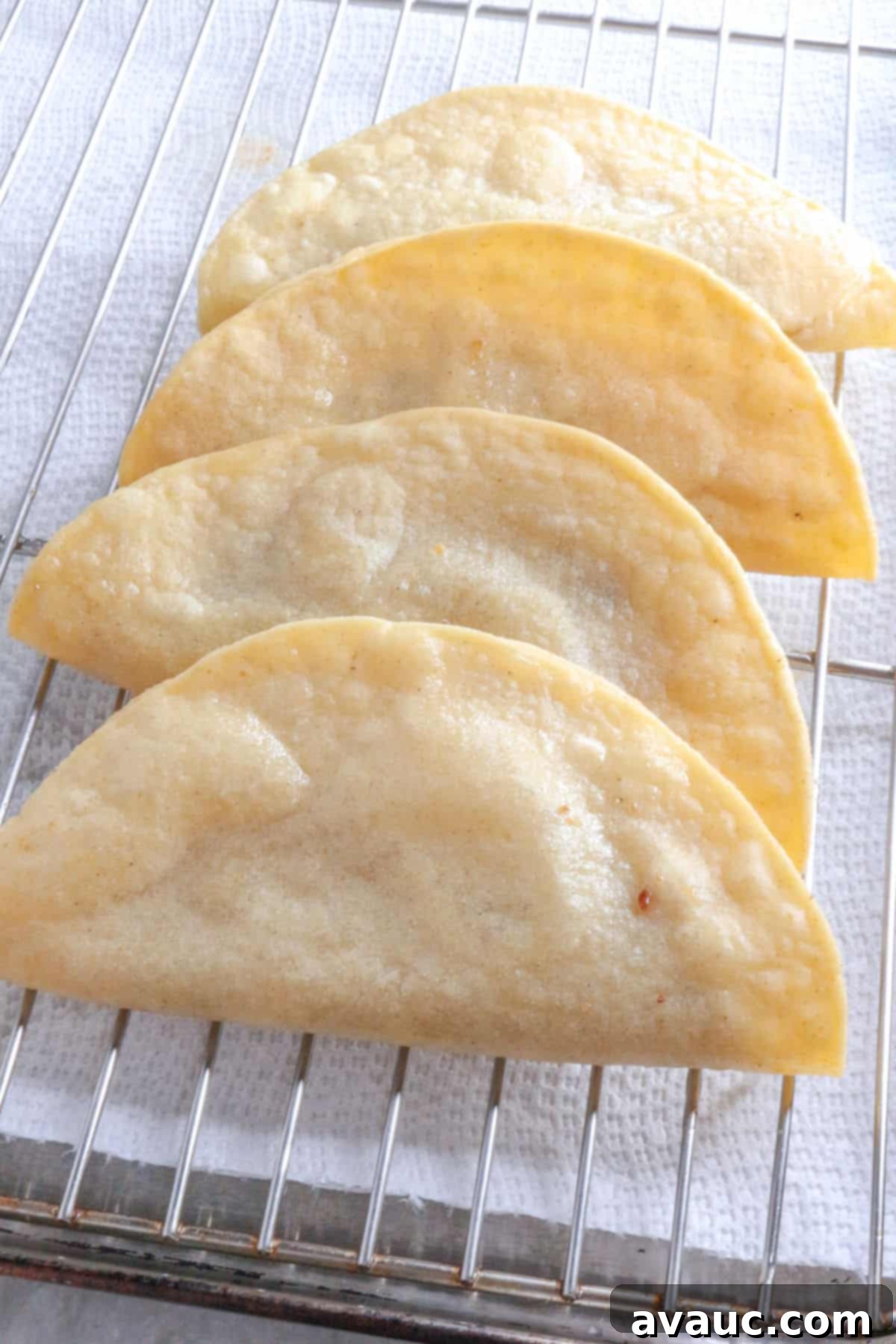 Golden Crispy Bean Tacos 8 Fried bean tacos draining on a wire rack