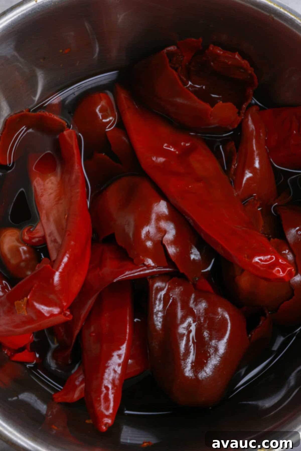 Slow-Cooked Red Chile Pork 4 Boiling dried red chiles in a pot of water