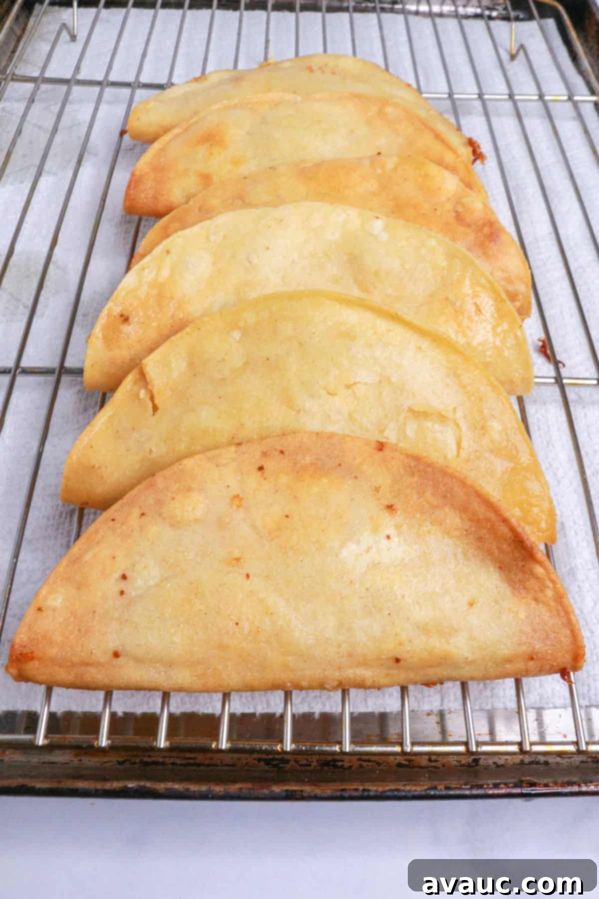 Golden Crispy Potato Tacos 9 Fried crispy potato tacos on a rack