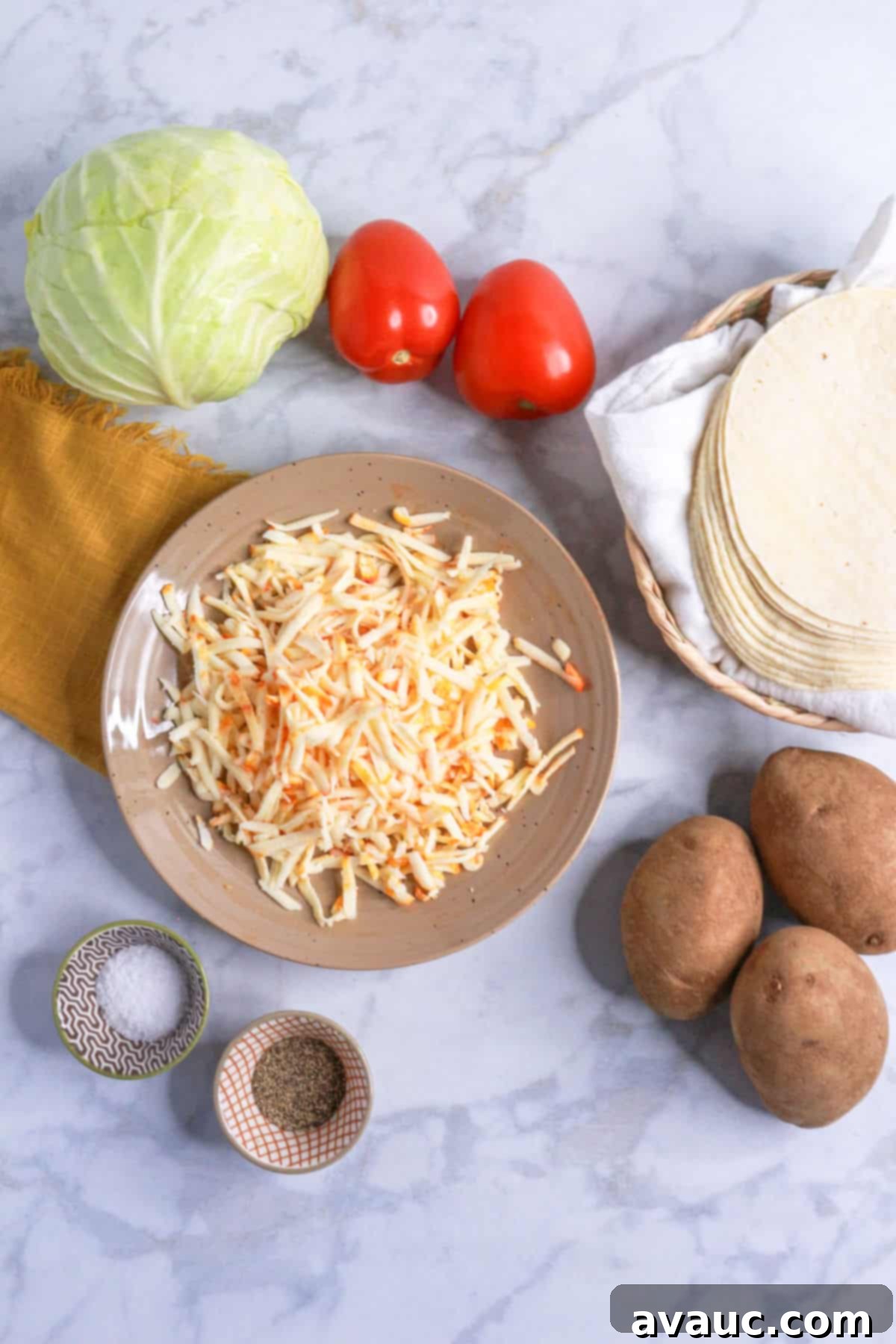 Golden Crispy Potato Tacos 3 Head of cabbage, tomatoes, corn tortillas, shredded cheese, potatoes and salt and pepper