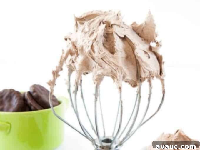 Delicious Thin Mint Buttercream spread over a rich chocolate cake, perfect for any celebration.