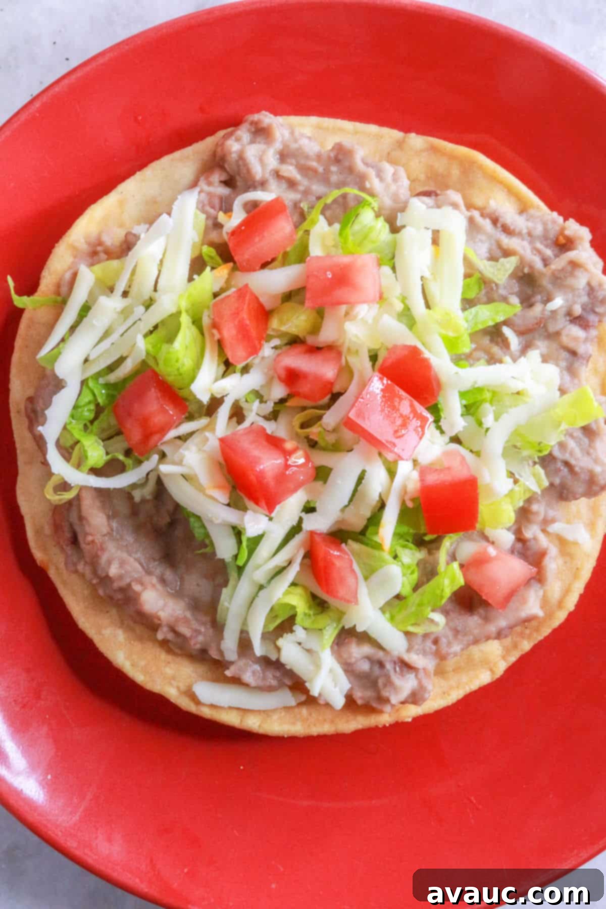 Crispy Bean Tostadas 8 Bean tostada with cheese, lettuce, and tomato