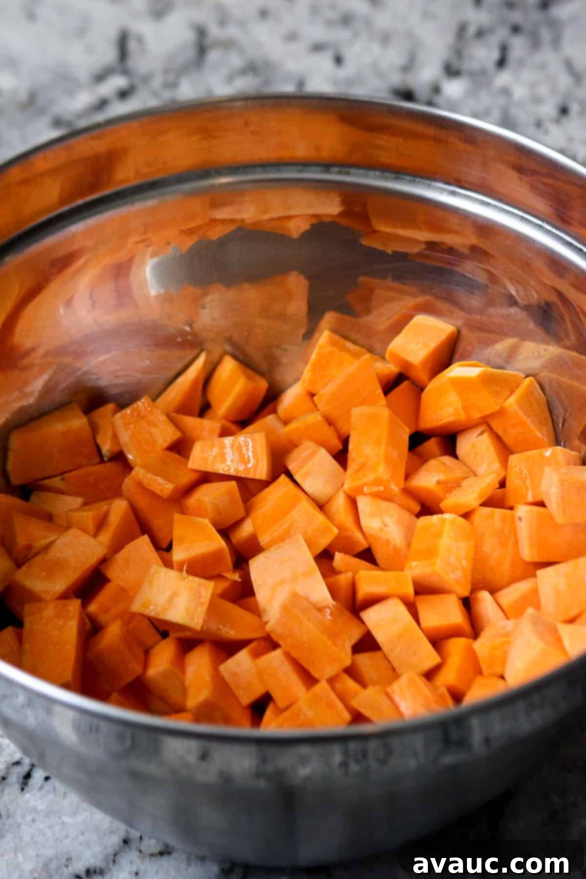 Vibrant Sweet Potato Taco Bowl 4 Diced sweet potatoes in a bowl, ready for roasting.