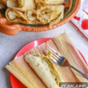 Green chile and cheese tamales in a Mexican bowl with an open green chile and cheese tamal on a plate