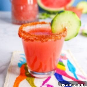 Vibrant Cucumber Watermelon Cooler 12 Cucumber watermelon agua fresca in a glass with cucumber garnish