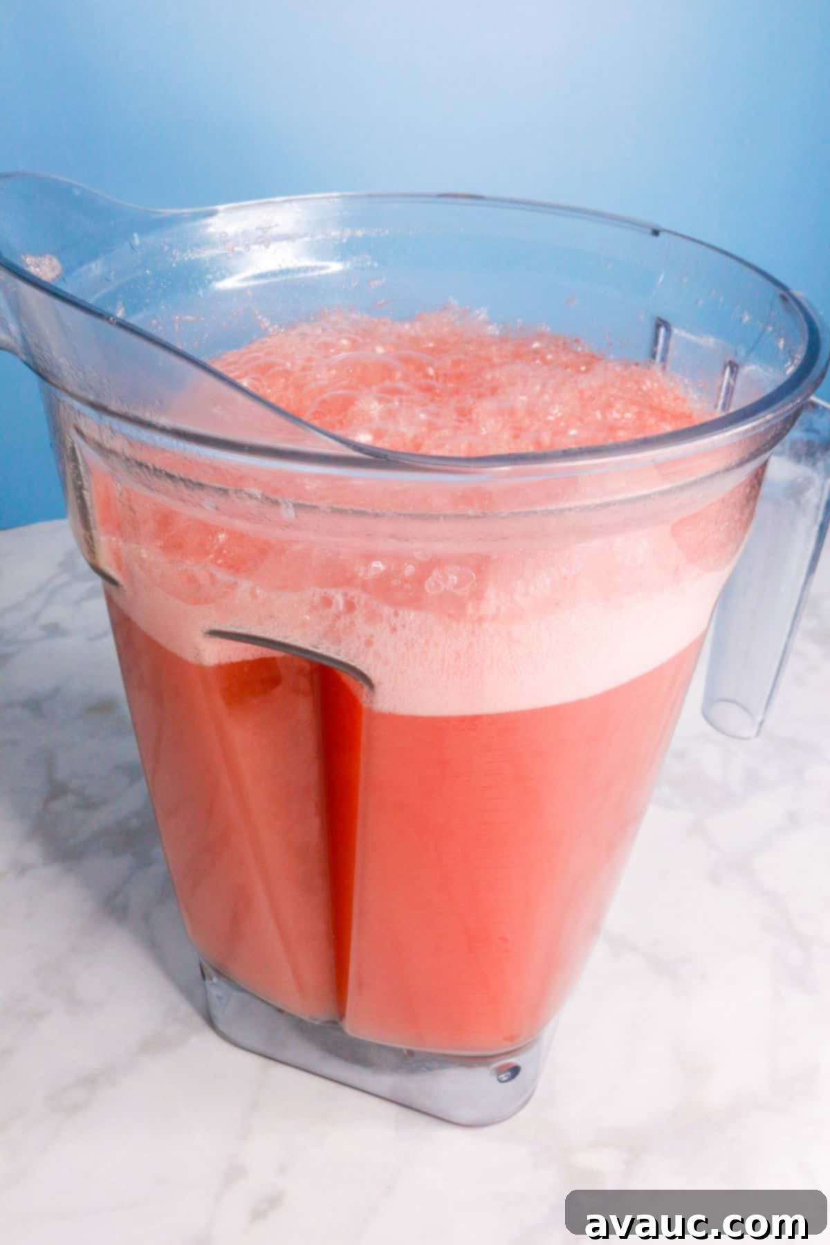Vibrant Cucumber Watermelon Cooler 8 Cucumber watermelon agua fresca, freshly blended and frothy, resting in a blender pitcher.