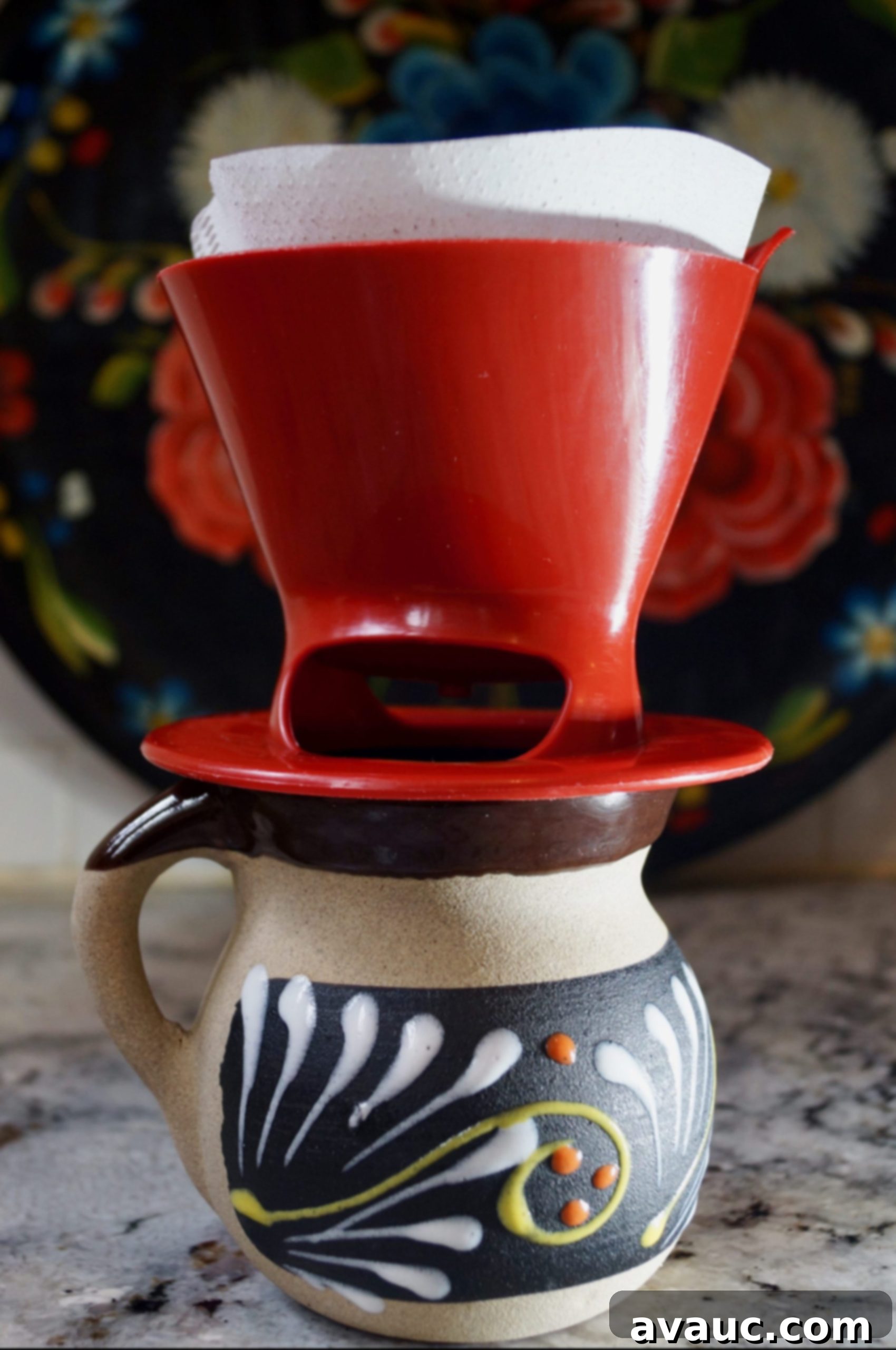 Pour over coffee dripper placed on a coffee cup, ready for brewing.