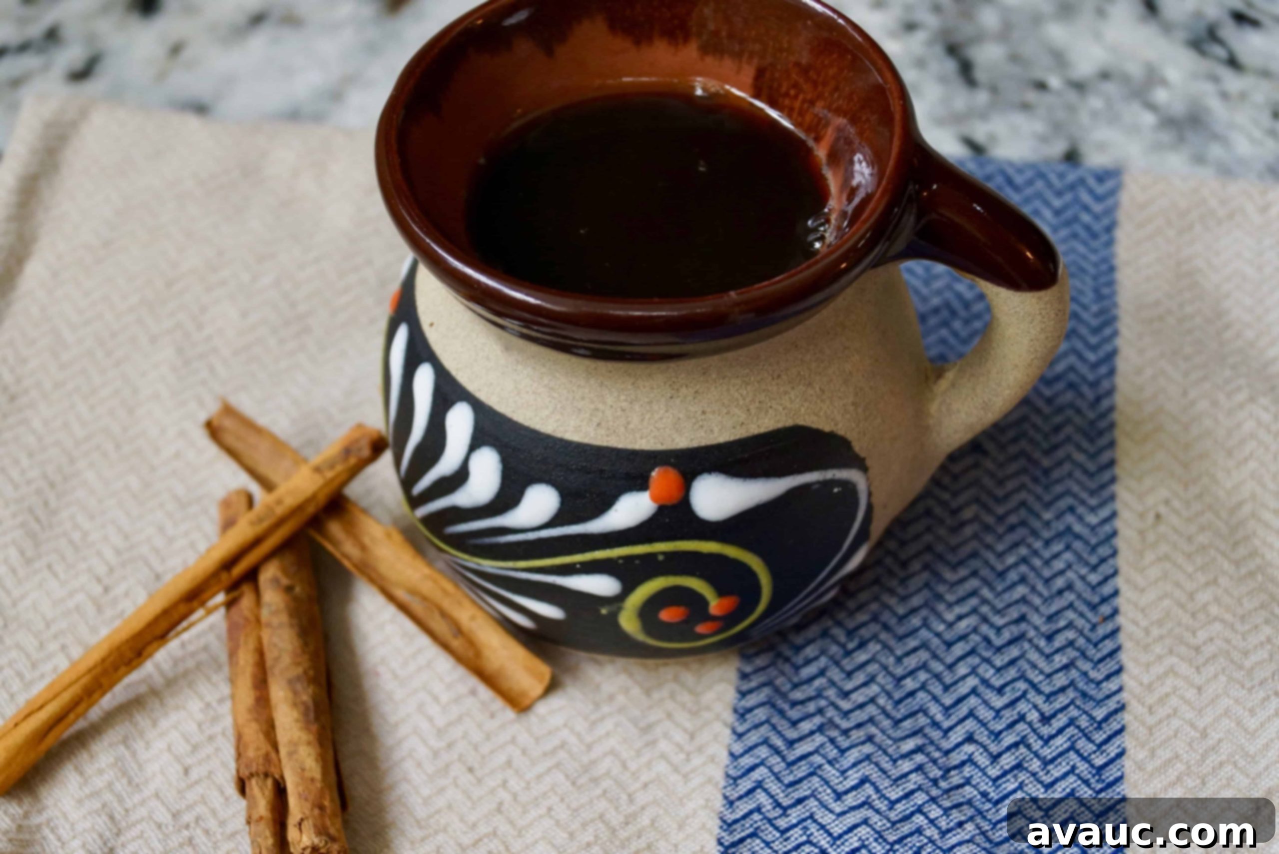 A freshly brewed cup of Mexican style coffee with cinnamon, ready to be enjoyed.