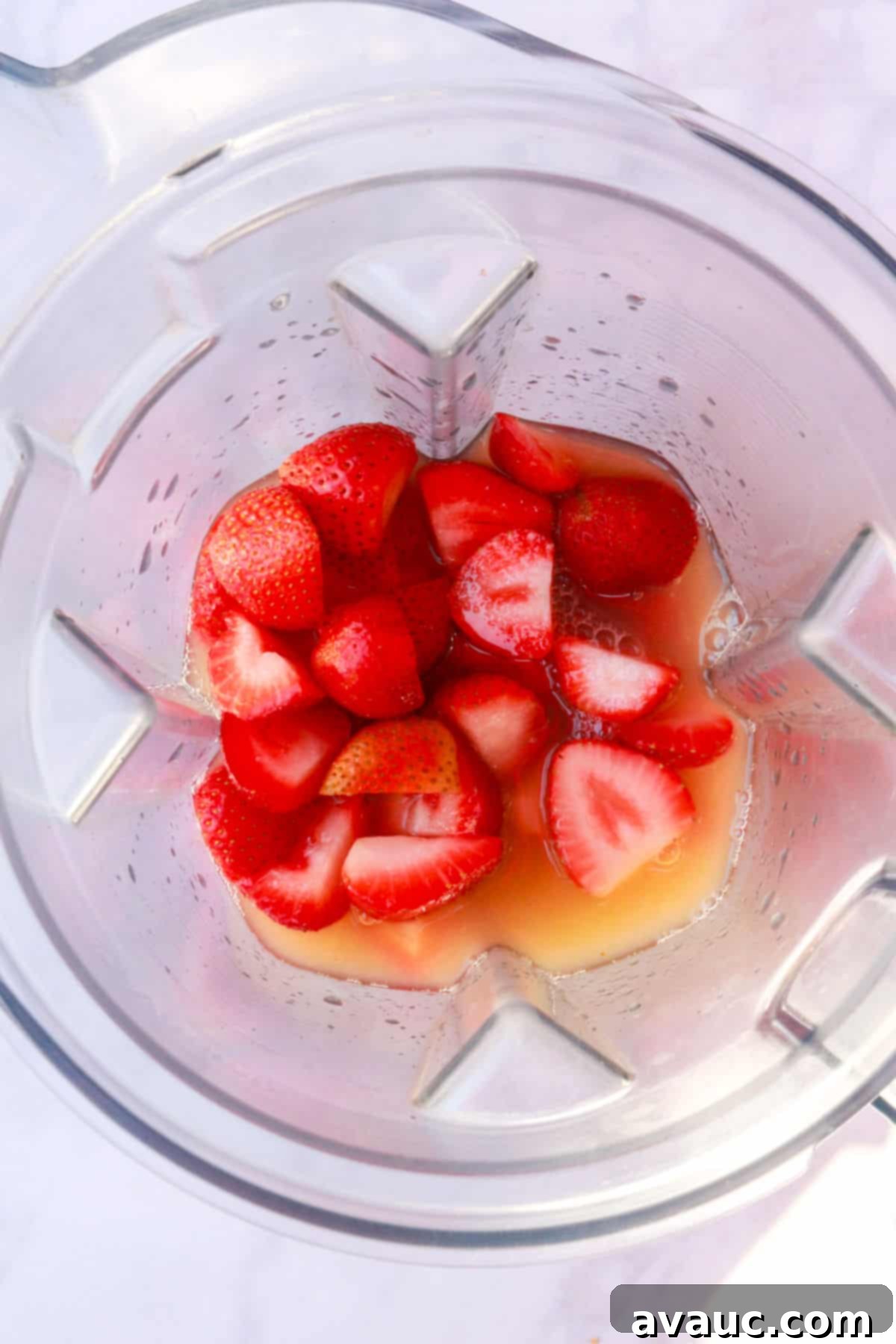 Strawberry Limeade 8 Strawberries, water, and lime juice being added to a blender