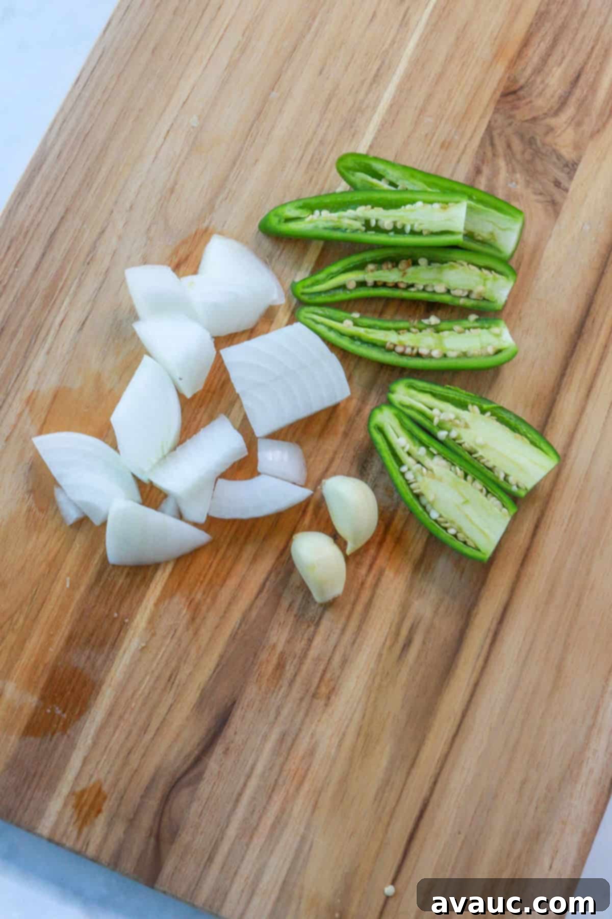 Mockamole 5 Sliced jalapeños and serranos, chopped onion, and two garlic cloves, prepped for sautéing