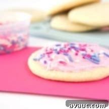 Velvet Smooth Sugar Cookie Icing 8 Homemade Sugar Cookie Frosting with pink swirls in a bowl, ready to be spread on cookies.