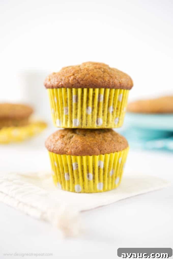 Golden brown, perfectly domed banana muffins cooling on a wire rack, ready for a delicious breakfast.