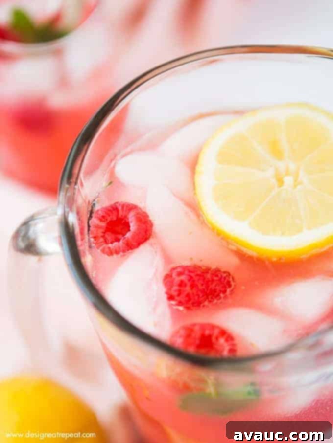 Add pureed raspberries to lemonade for a colorful and refreshing summer drink! Find the recipe for Homemade Raspberry Lemonade at Design Eat Repeat.