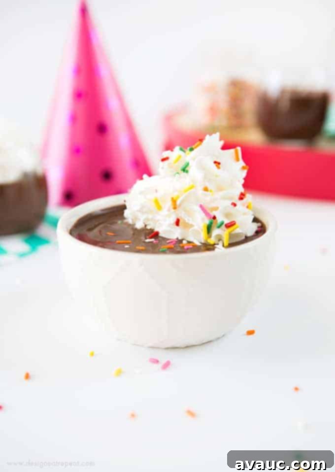 A close-up of dark, rich chocolate pudding with a smooth, inviting texture.