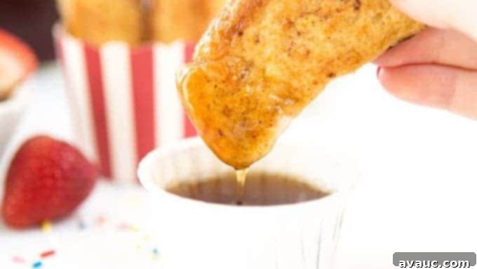 Hand dipping french toast sticks