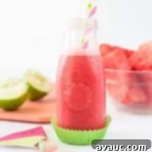 Close-up of a refreshing Raspberry Watermelon Slushie in a glass.
