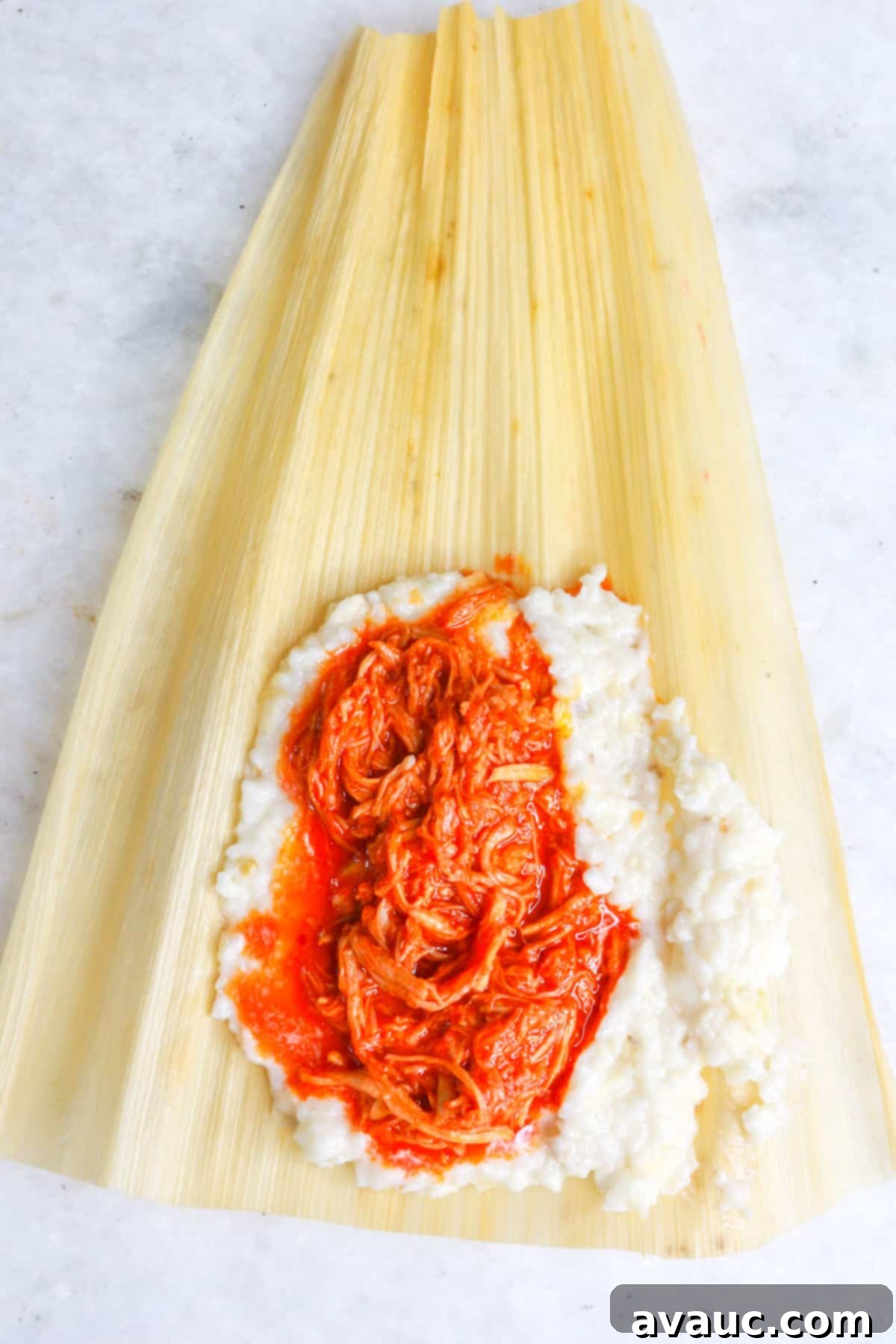 Red Chile Pork Tamales 10 Raw tamal with chile colorado ready to be folded and steamed