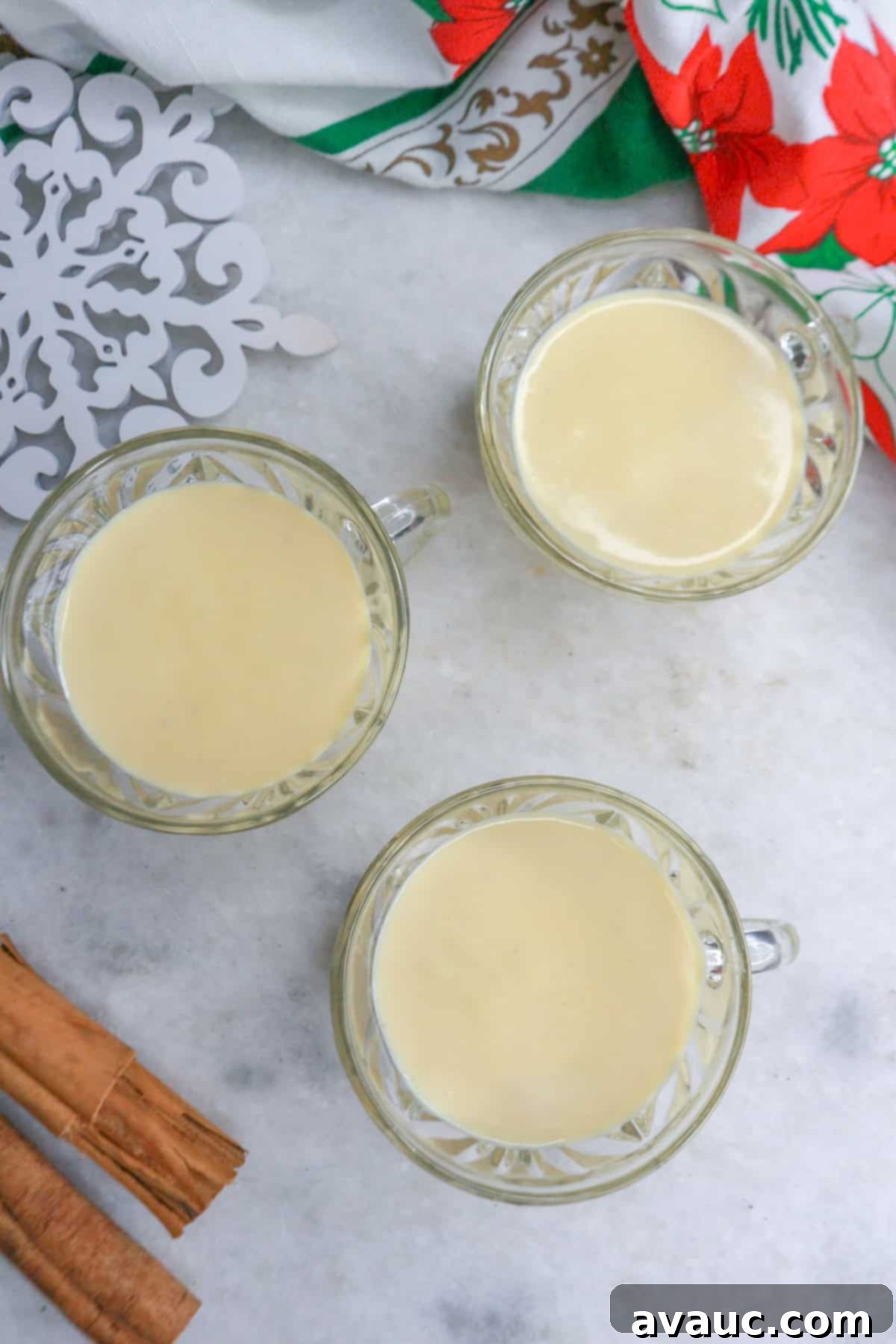 Rompope Mexicos Creamy Eggnog 11 Overhead view of 3 glasses with Rompope, garnished with cinnamon