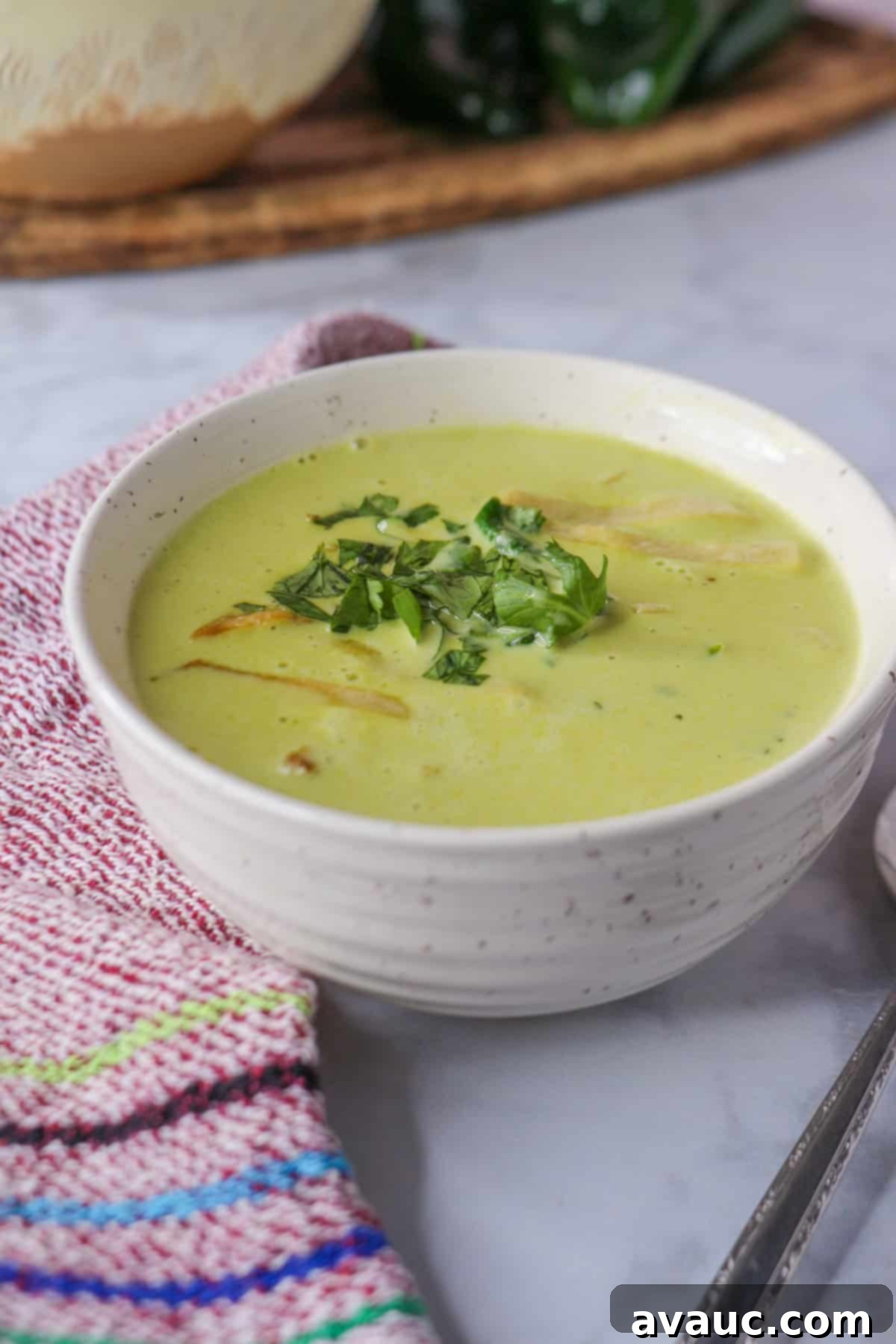 Hearty Poblano Soup: Dairy-Free Creaminess 13 Poblano cream soup in a bowl garnished with tortilla strips and cilantro