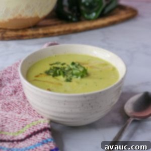Hearty Poblano Soup: Dairy-Free Creaminess 14 Poblano cream soup in a bowl garnished with tortilla strips and cilantro